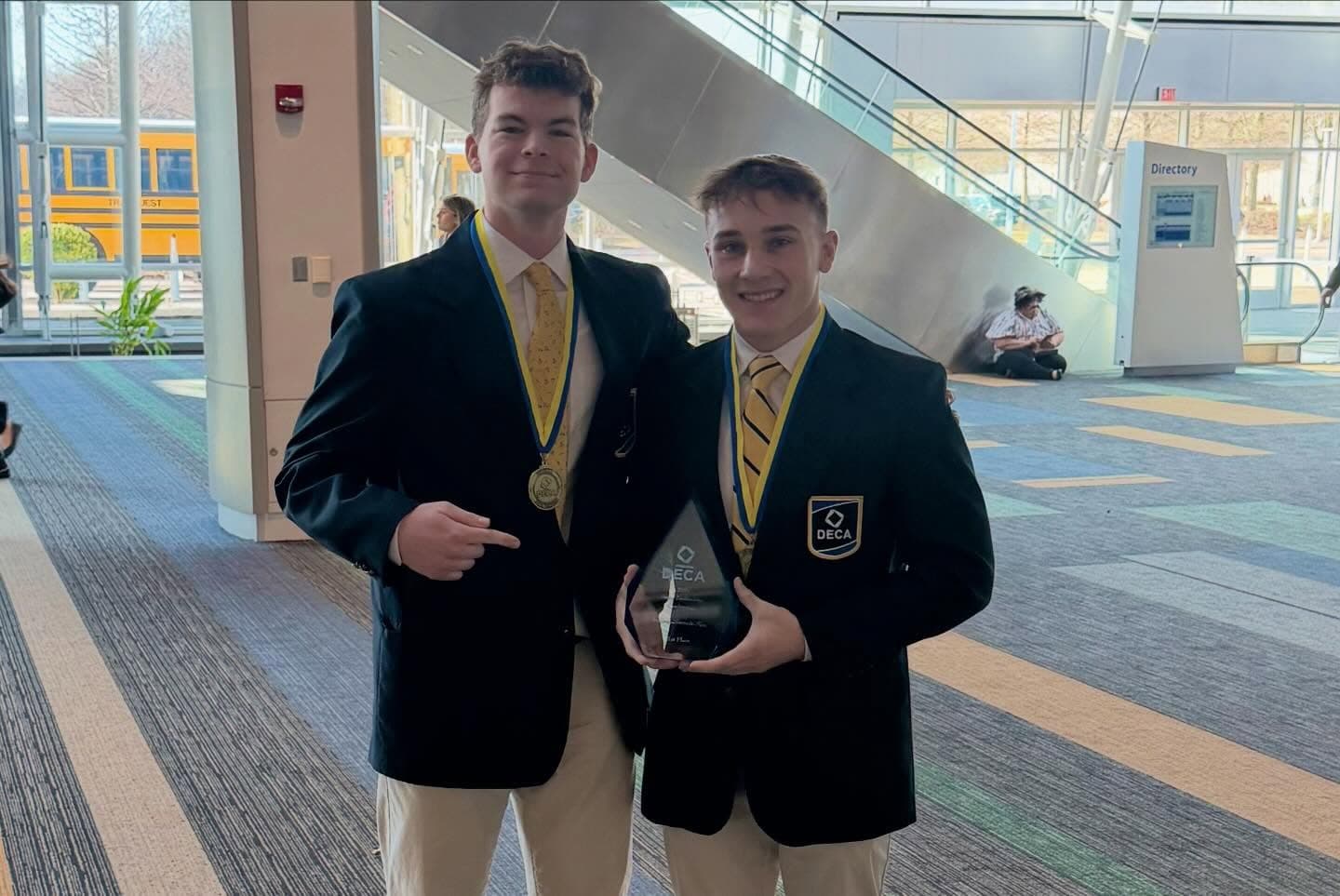 Sean Hodel and Lincoln Hahn with their DECA Business Growth Plan state championship trophy