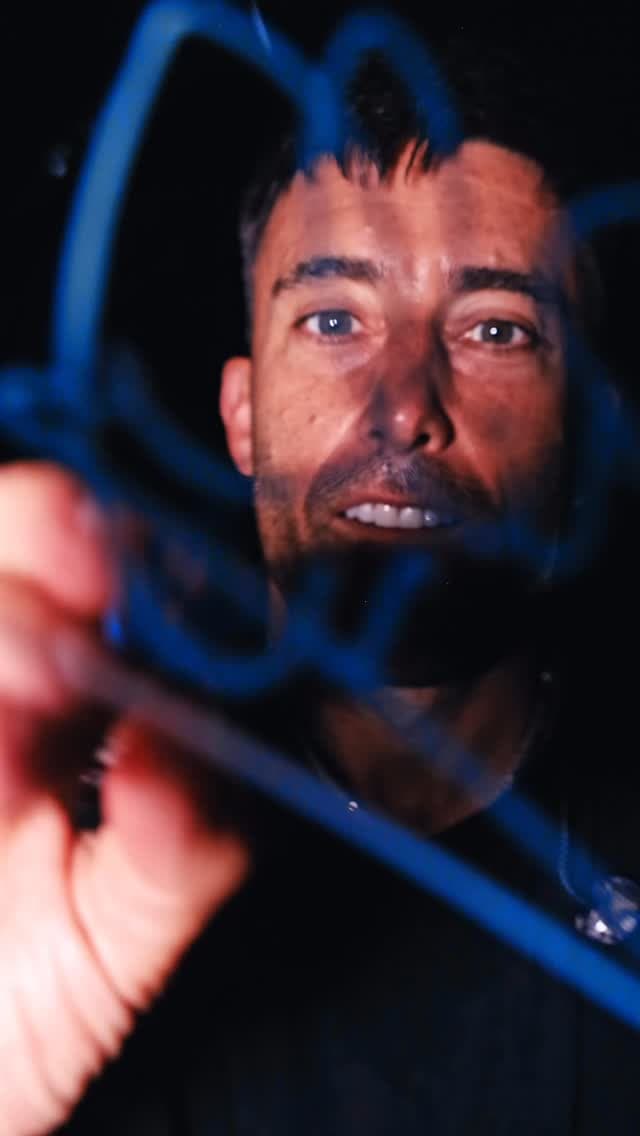 Christian artist Phil Wickham signing Sean Hodel's camera lens