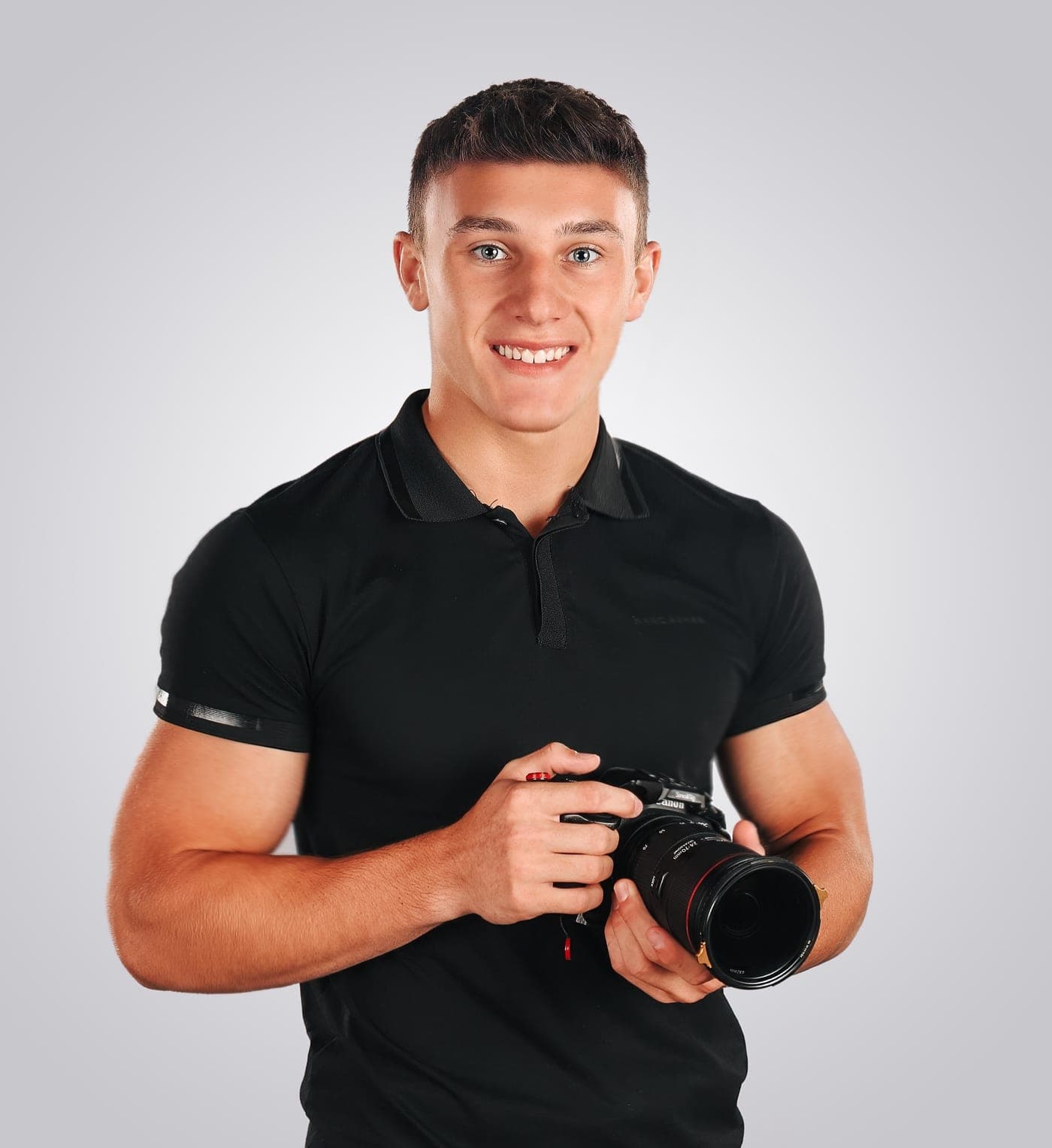 Sean Hodel, owner of Local Klicks, holding a camera